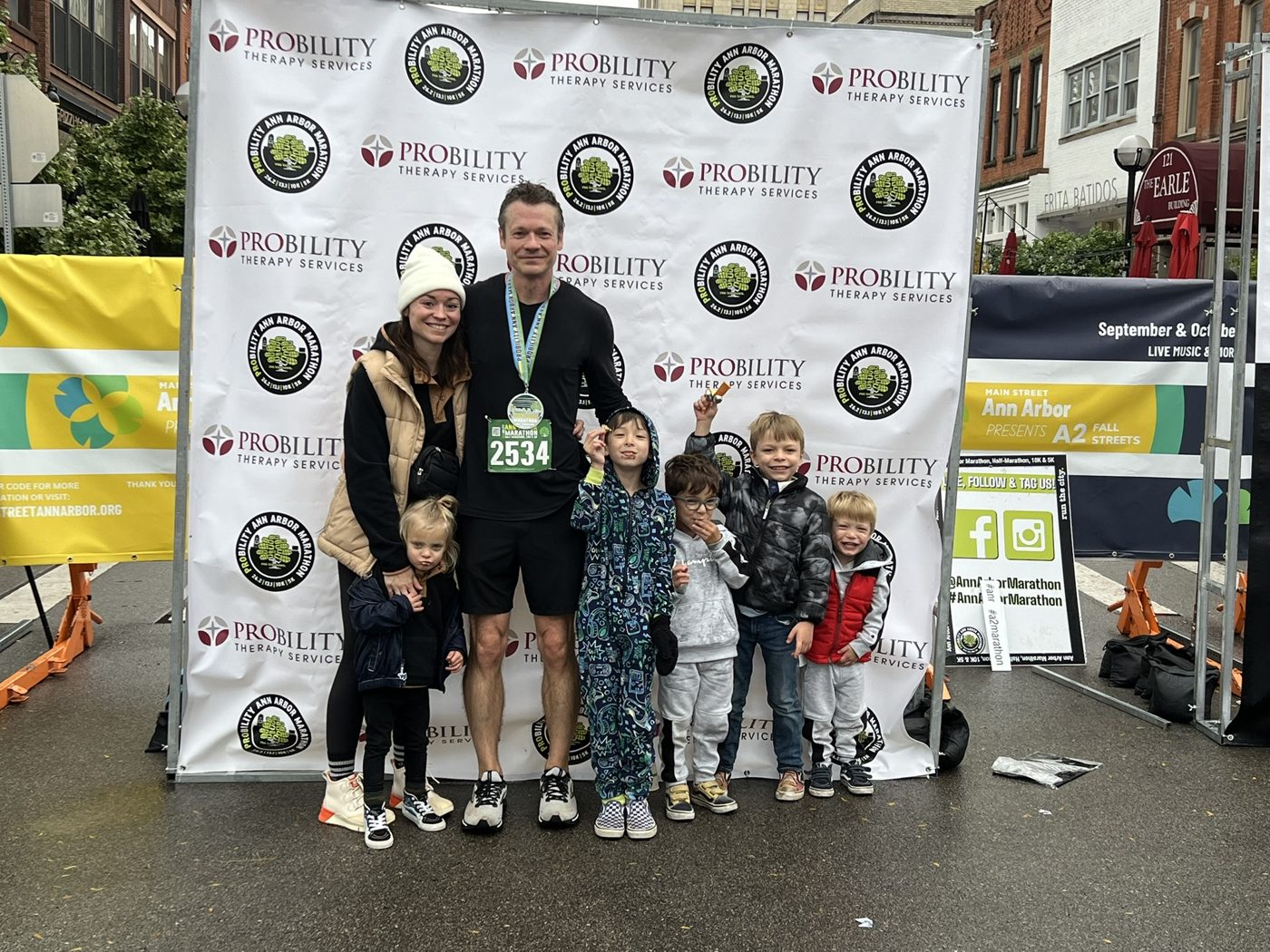 Chris Schults with his family at the Ann Arbor Marathon finish line