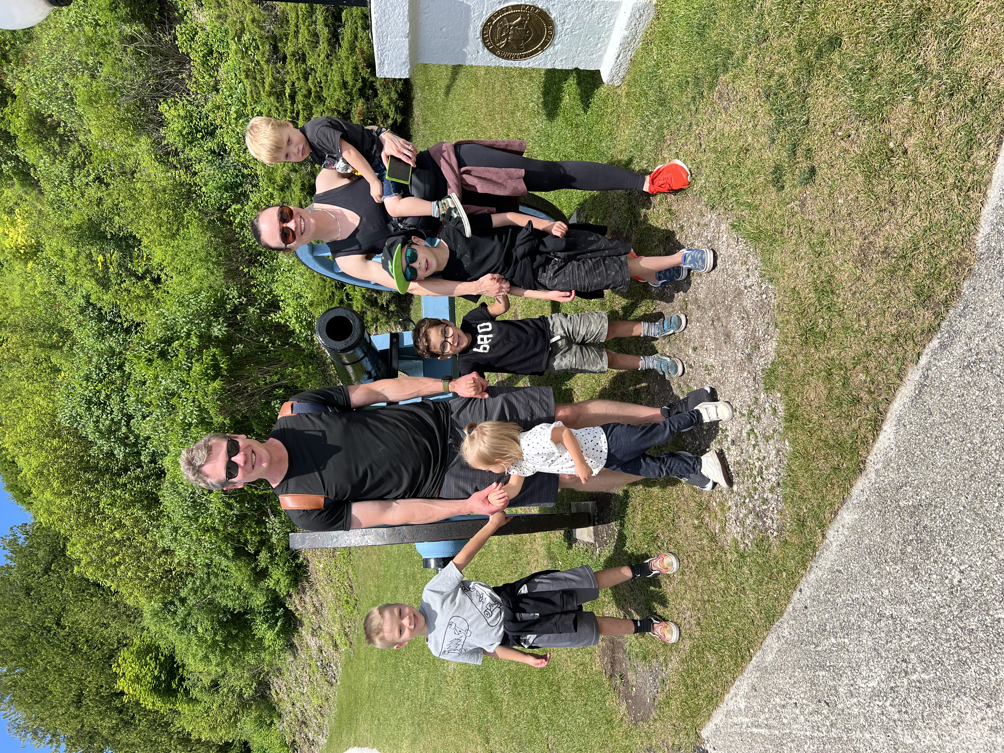 Chris Schults outdoors with his wife and five children